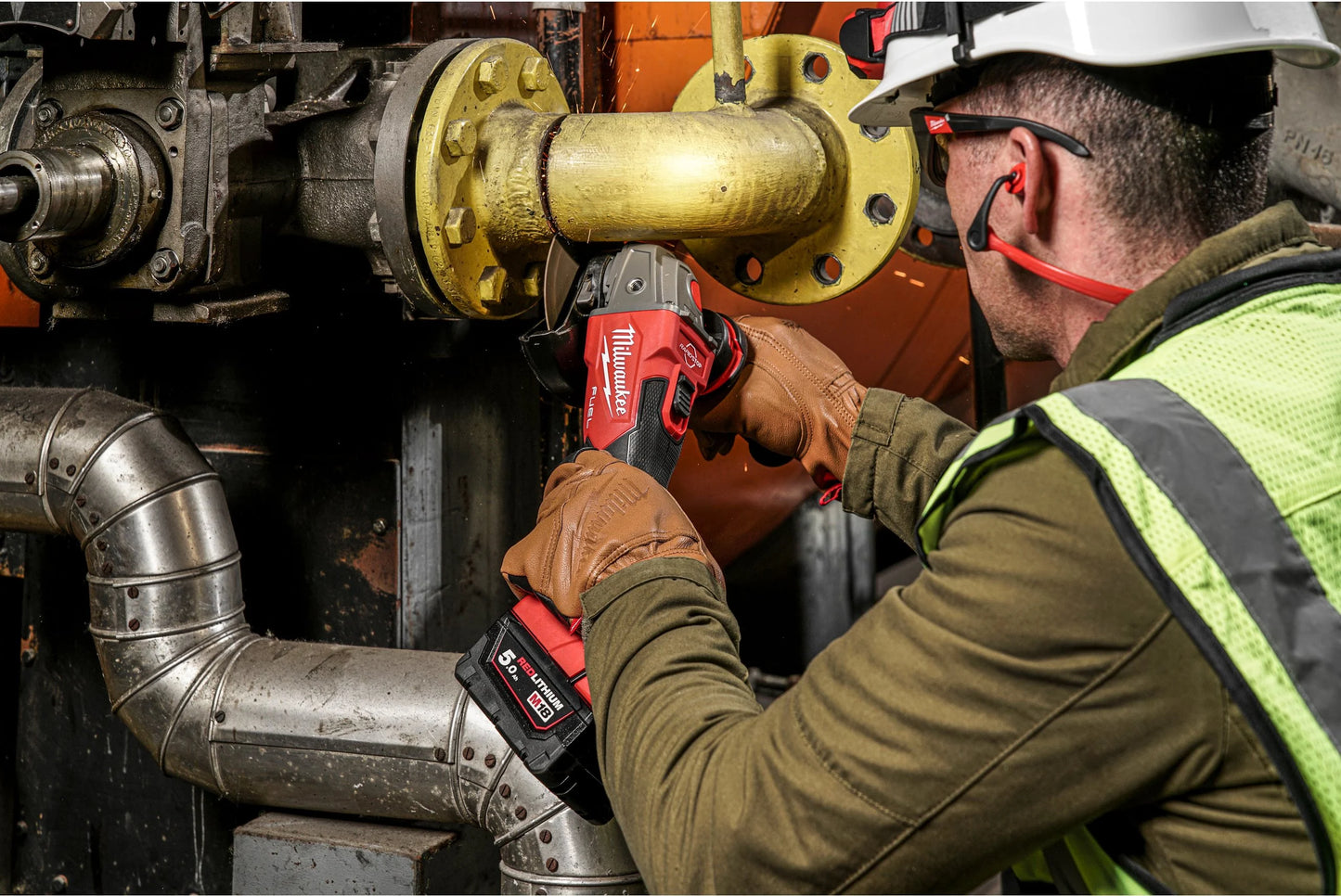 Meuleuse d’angle M18 125 mm avec frein et interrupteur à bouton + 2 batteries 5 Ah + chargeur + mallette Milwaukee M18 FSAG125XB-502X